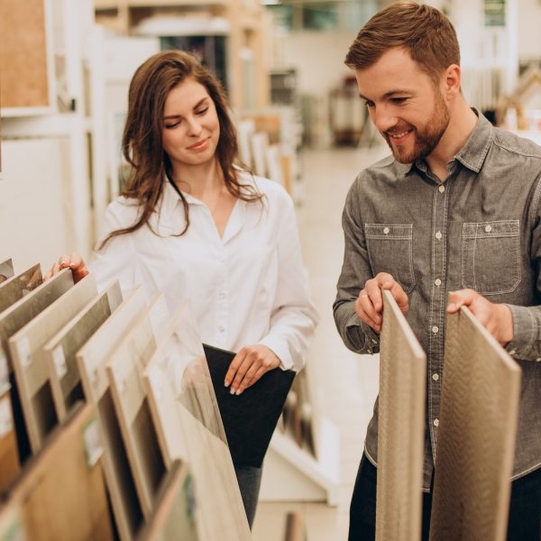 young couple looking at flooring samples