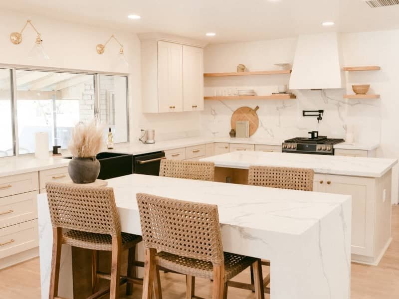 modern white kitchen with double cascade countertop islands